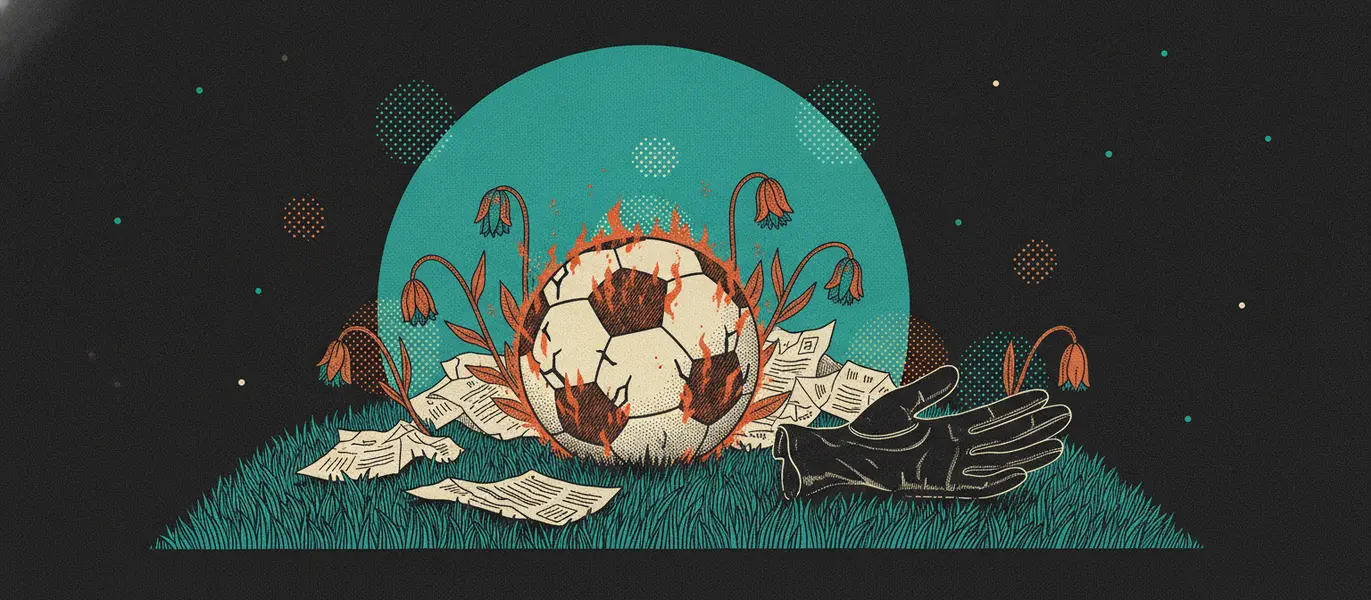 Bola de futebol rachada e queimada no gramado, cercada por papéis amassados e flores murchas, com uma luva vazia ao lado